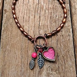 Copper bead cord bracelet with pink charms